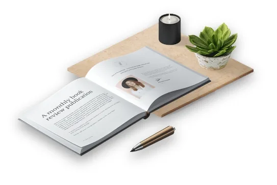 An open book with formatted pages on a desk beside a candle, plant and pen