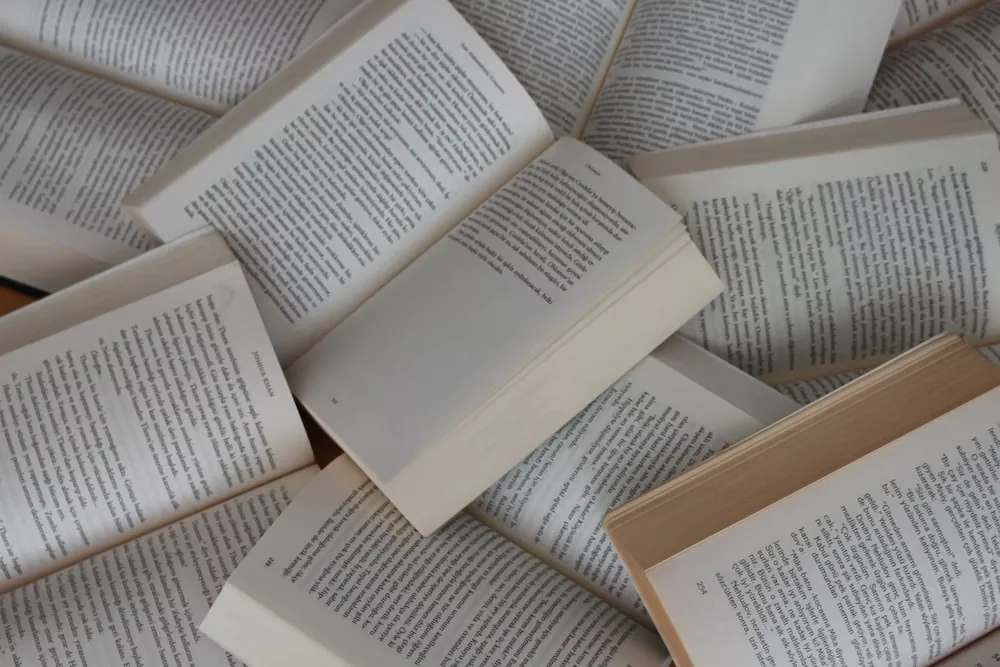 Open books scattered across a table