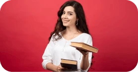 Smiling woman holding a stack of books